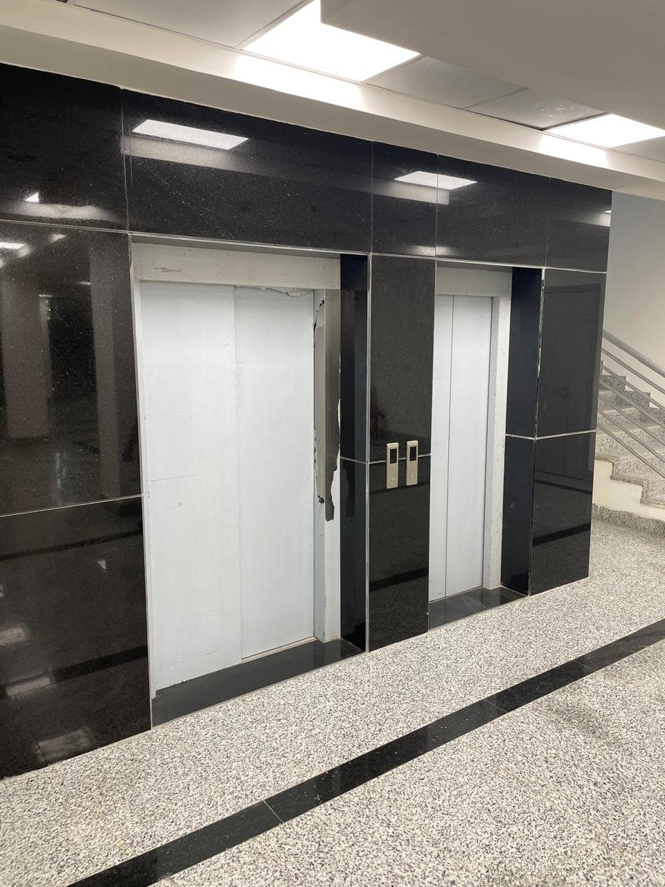 Elevator hall — black granite cladding and granite flooring