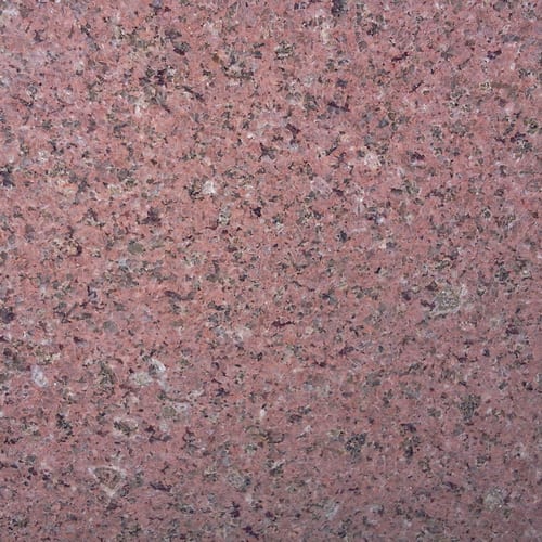 Red Safaga Light granite slab face, photographed for the factory catalog — mid-toned red overall.