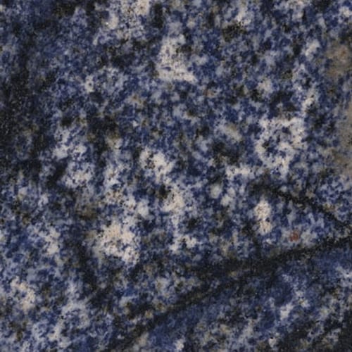 Azul Bahia granite slab face, photographed for the factory catalog — deep blue overall.