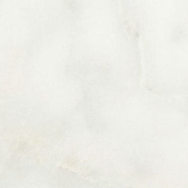 Bianco Europa marble slab face, photographed for the factory catalog — near-white warm beige overall.