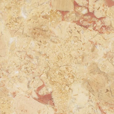 Breccia Rosata marble slab face, photographed for the factory catalog — light amber overall.