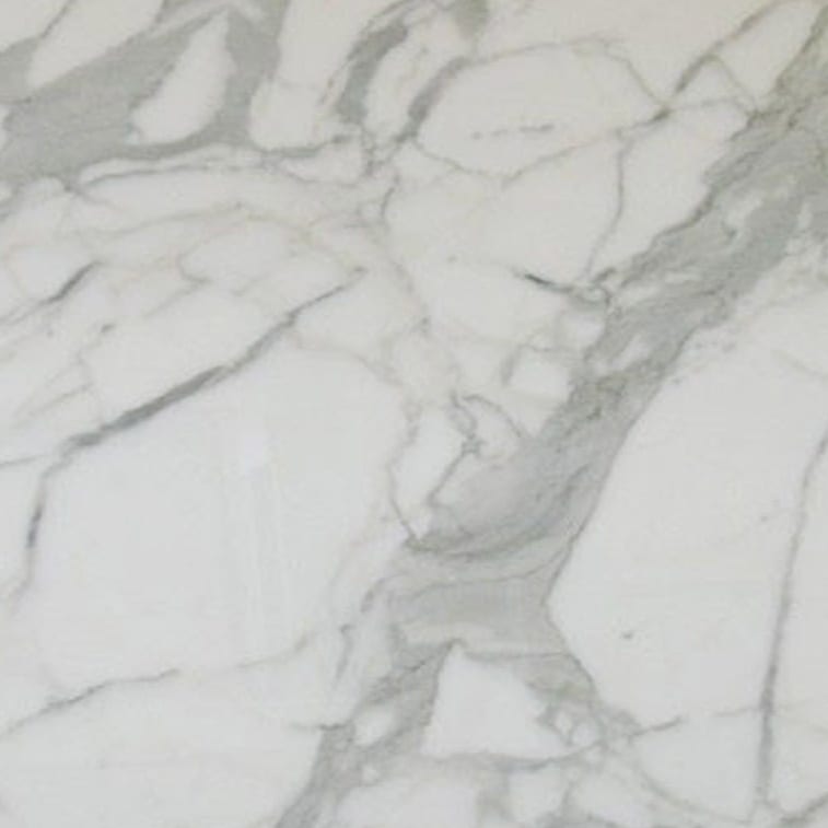 Calacatta B marble slab face, photographed for the factory catalog — light grey overall.