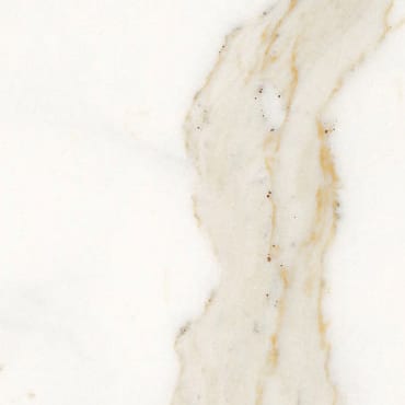 Calacatta Cremo marble slab face, photographed for the factory catalog — near-white gold overall.