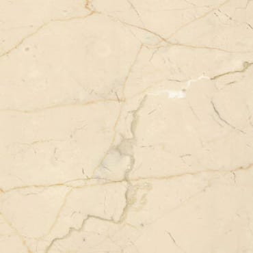 Crema Luna marble slab face, photographed for the factory catalog — near-white amber overall.