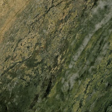 Irish Marble Green marble slab face, photographed for the factory catalog — deep gold overall.