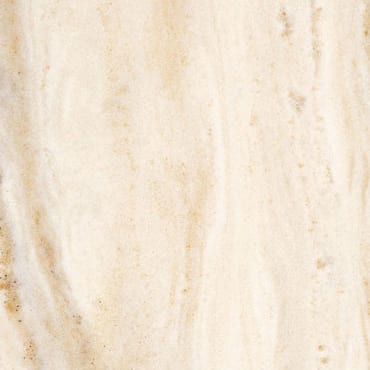 Palissandro marble slab face, photographed for the factory catalog — near-white amber overall.